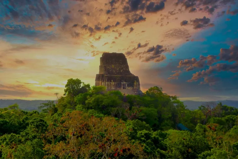 Temple rising above the jungle canopy at Tikal